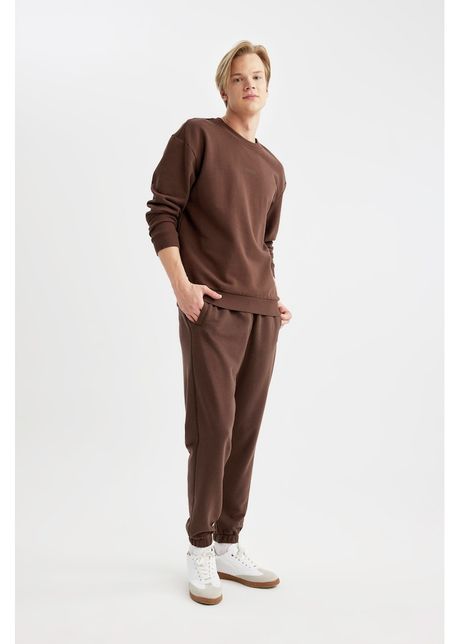 Pantaloni de trening relaxed fit cu buzunare laterale